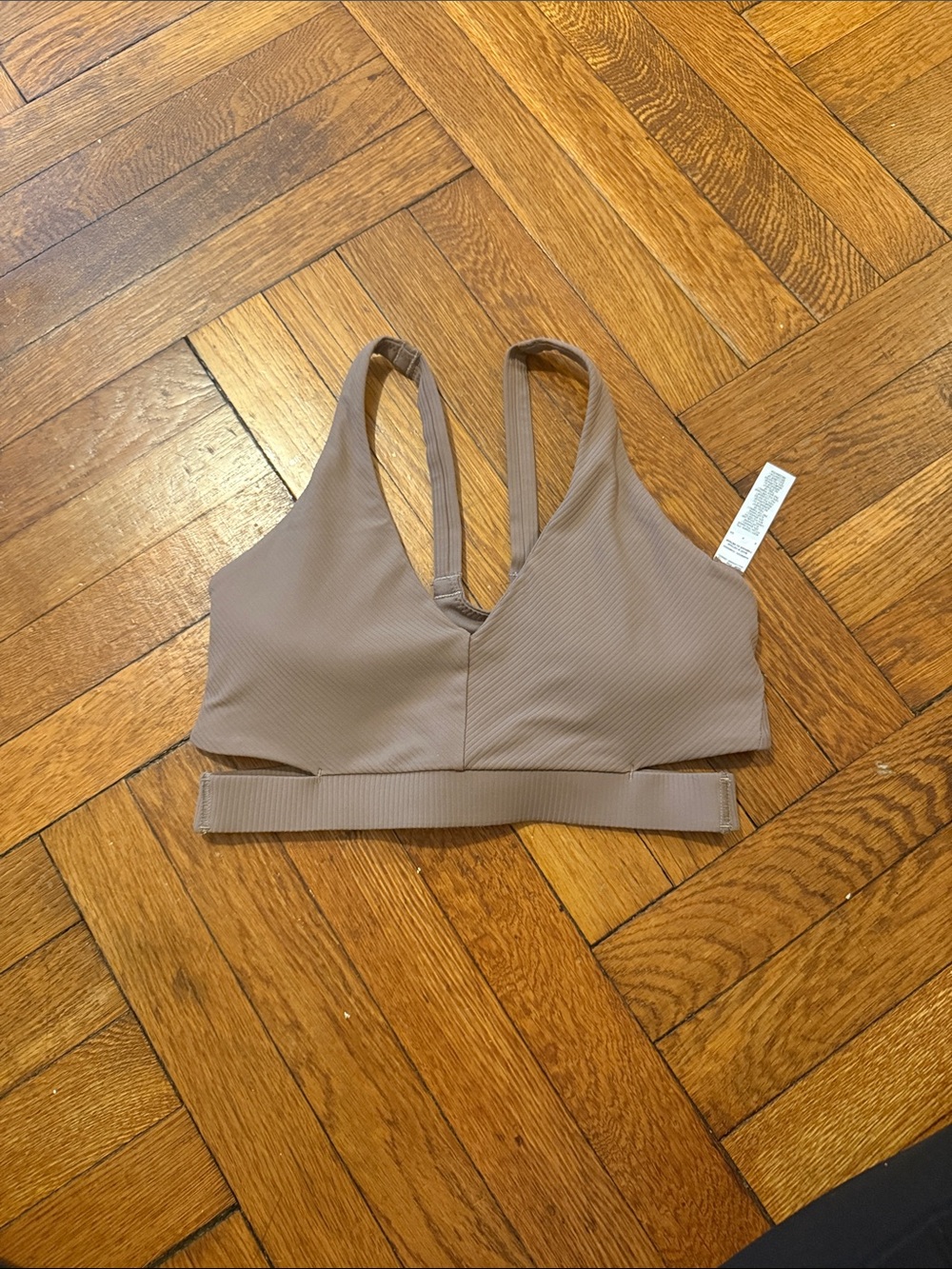 Nike Ribbed Cut Out V‑Neck Bralette in Taupe